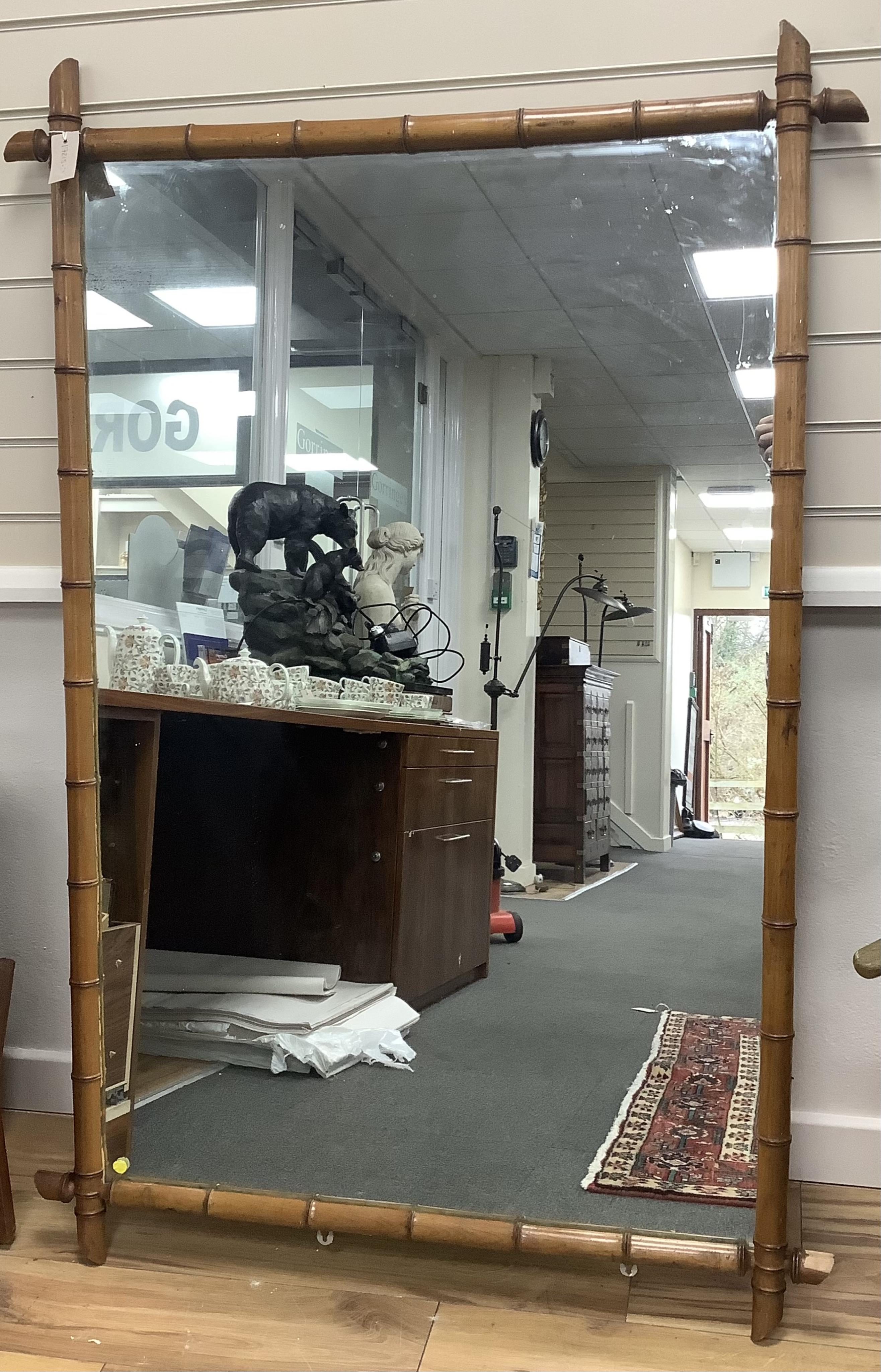 A large 19th century French rectangular simulated bamboo wall mirror, width 100cm, height 150cm. Condition - fair, one corner with a large chip to timber